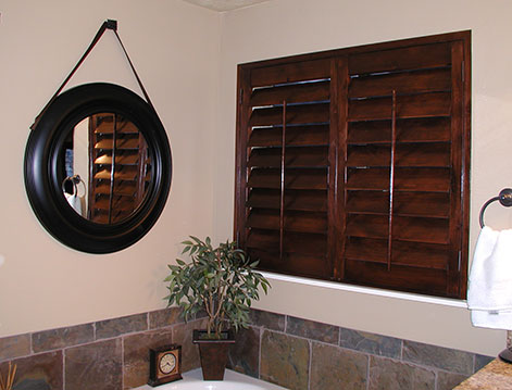 Wood plantation shutters installed in bathroom